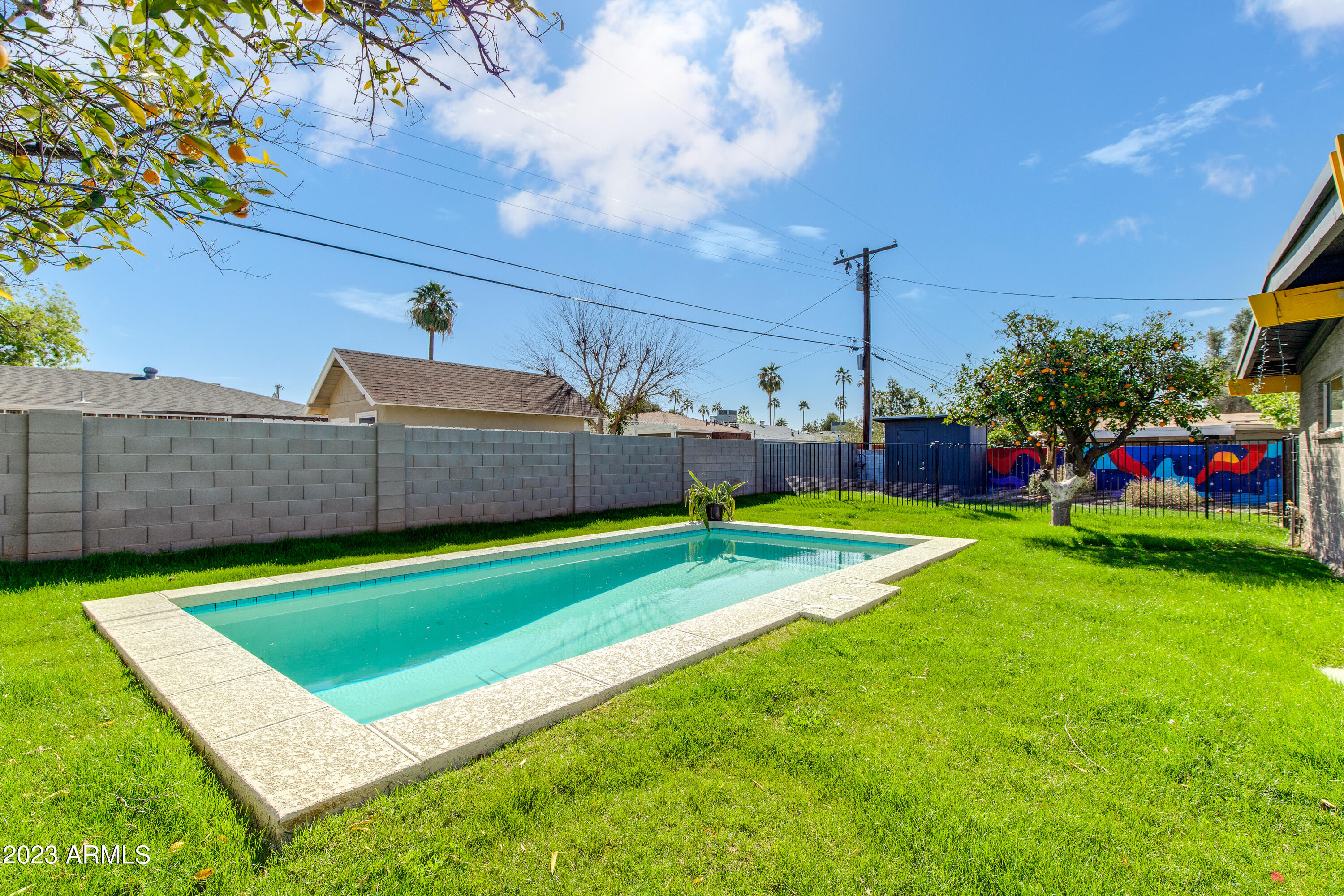 5719 North 11th Street Phoenix, AZ 85014 - Photo 15 of 18 a view of yard with swimming pool and green space
