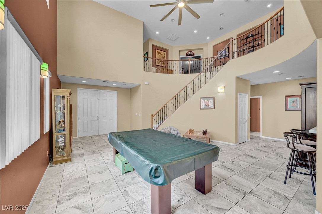3930 Burma Road North Las Vegas, NV 89032 - Photo 11 of 73 Front living room - used as a game room - features 72' custom ceiling fan