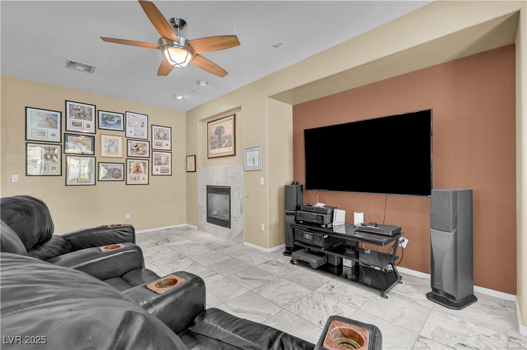 3930 Burma Road North Las Vegas, NV 89032 - Photo 34 of 73 Features ceiling fan, tile flooring, surround sound