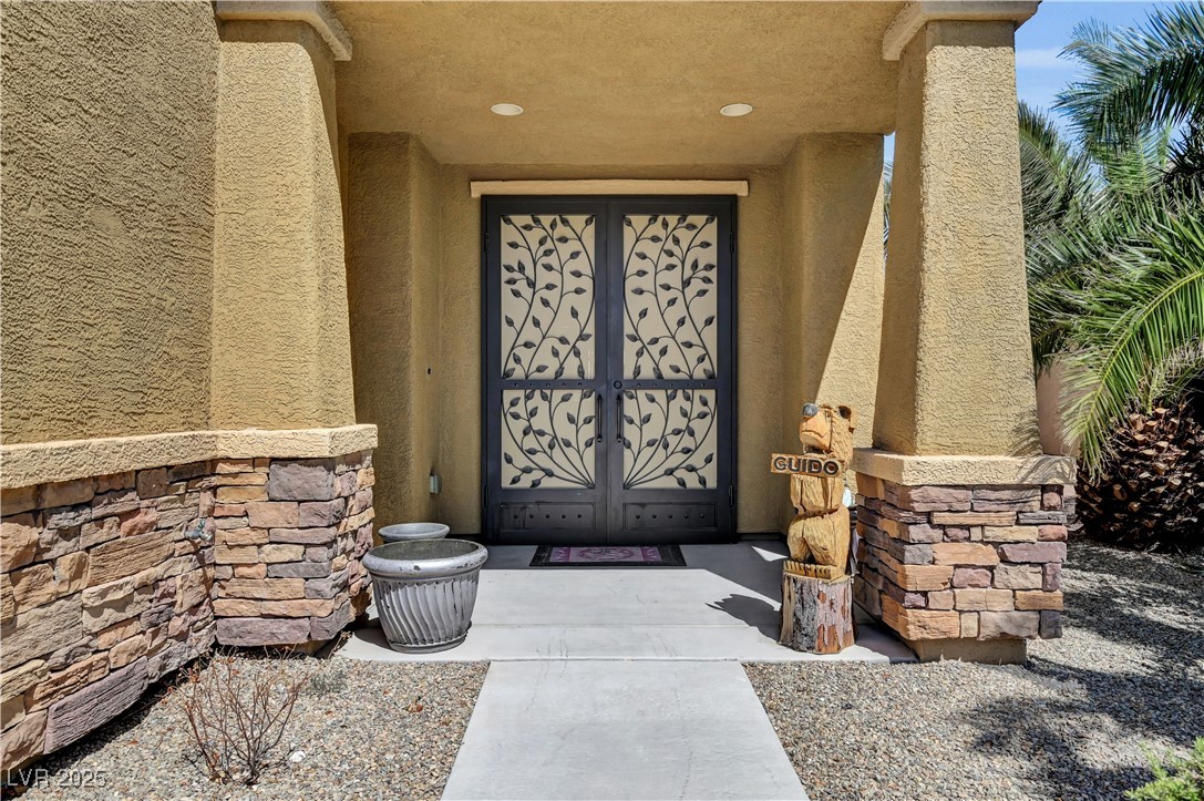 3930 Burma Road North Las Vegas, NV 89032 - Photo 4 of 73 Covered porch entry with custom security doors