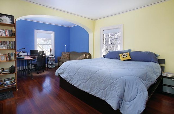 15 Kennard Road Brookline, MA 02445 - Photo 11 of 13 a bedroom with a bed and wooden floor