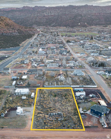 740 Elm Street, Unit 12 Hildale, UT 84784 - Photo 7 of 11 Aerial overview of property's location featuring a mountain backdrop and property parcel outlined