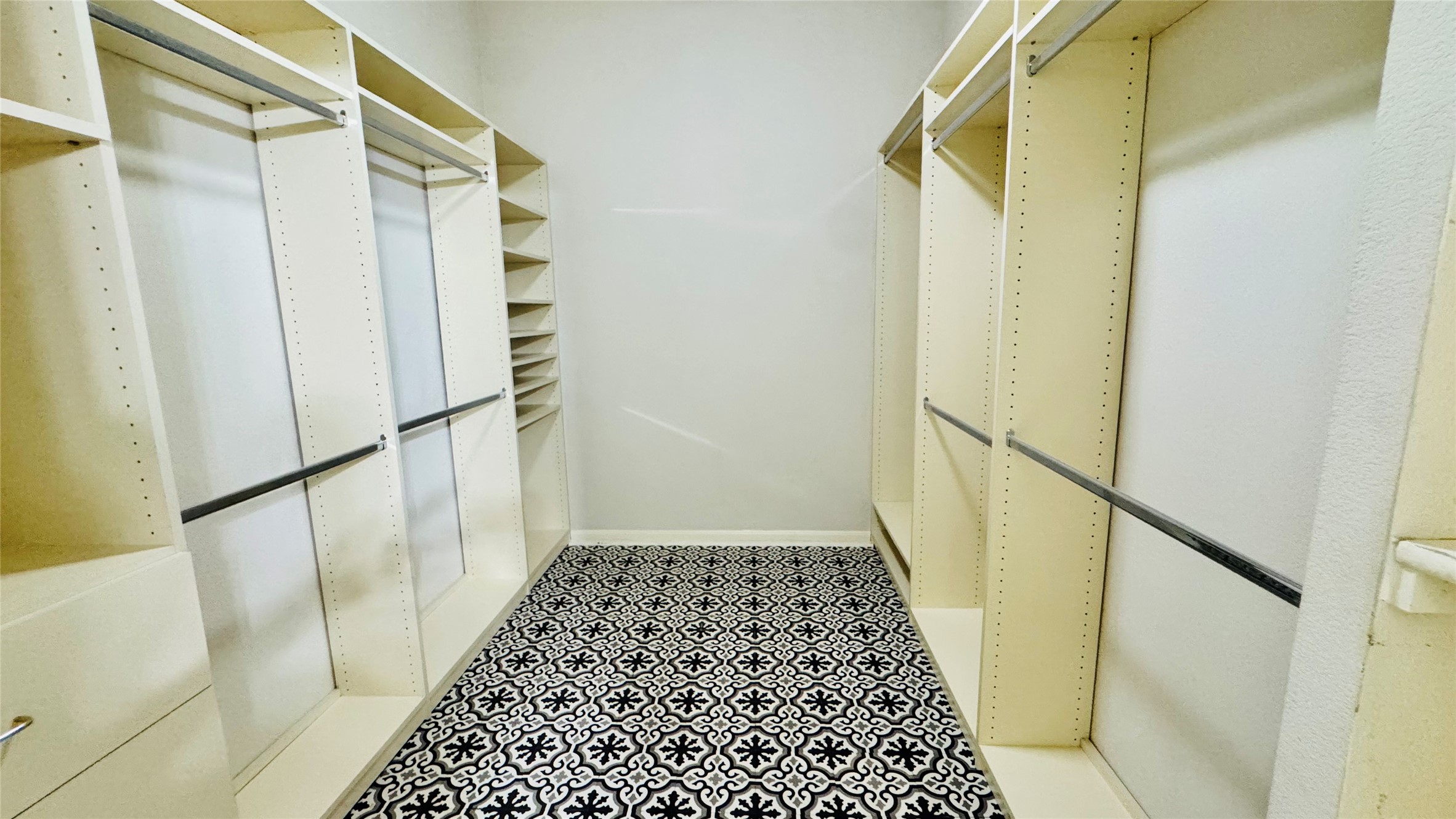 401 Witte Road Kyle, TX 78640 - Photo 12 of 24 Master closet- Ample built-in storage and hanging space define this highly functional walk-in closet.