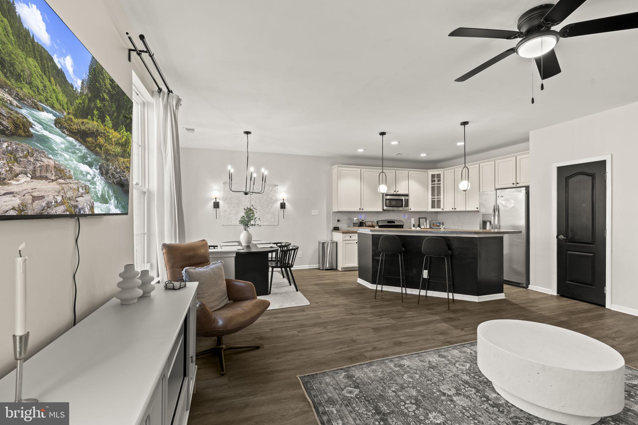 103 Oak Ridge Drive Mount Royal, NJ 08061 - Photo 11 of 34 a living room with furniture and a chandelier