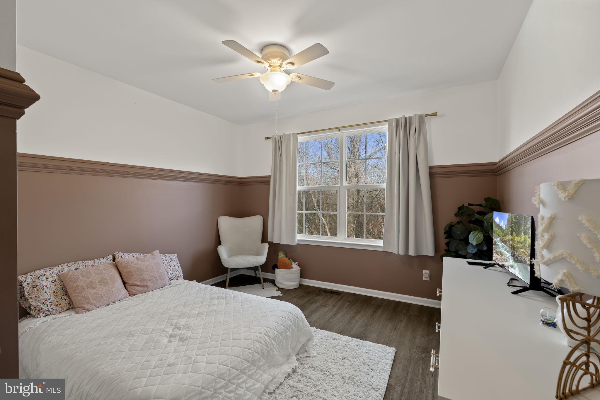 103 Oak Ridge Drive Mount Royal, NJ 08061 - Photo 17 of 34 a bedroom with a large bed and a window