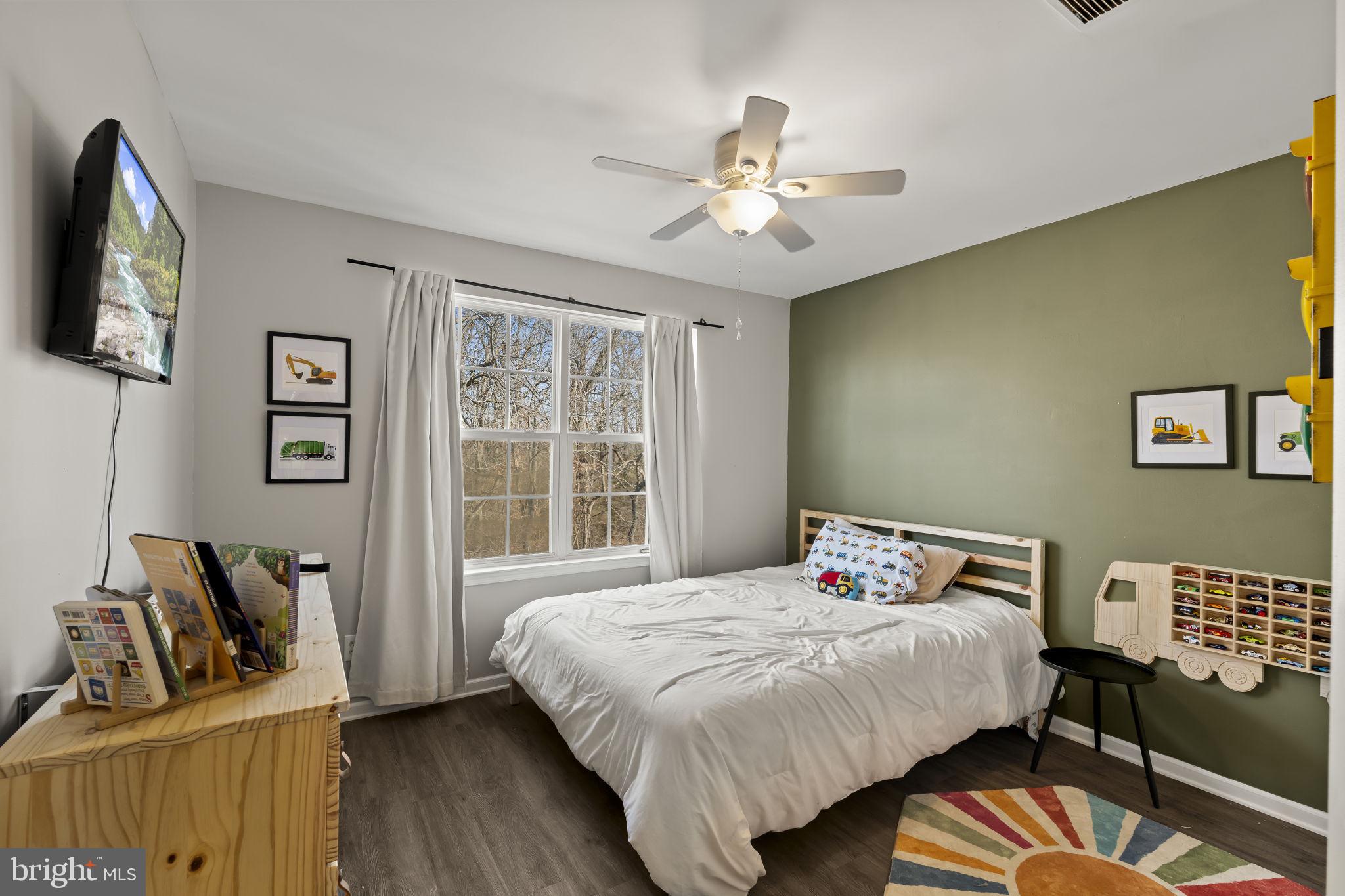 103 Oak Ridge Drive Mount Royal, NJ 08061 - Photo 19 of 34 a bedroom with a bed and wooden floor