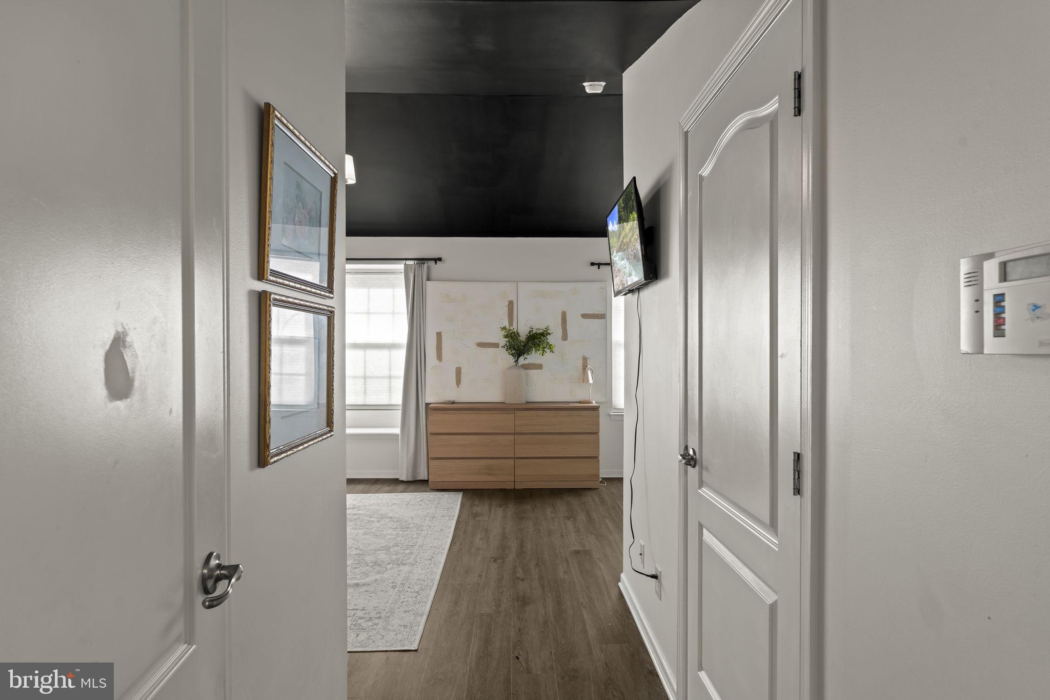 103 Oak Ridge Drive Mount Royal, NJ 08061 - Photo 23 of 34 a view of a hallway with wooden floor and staircase