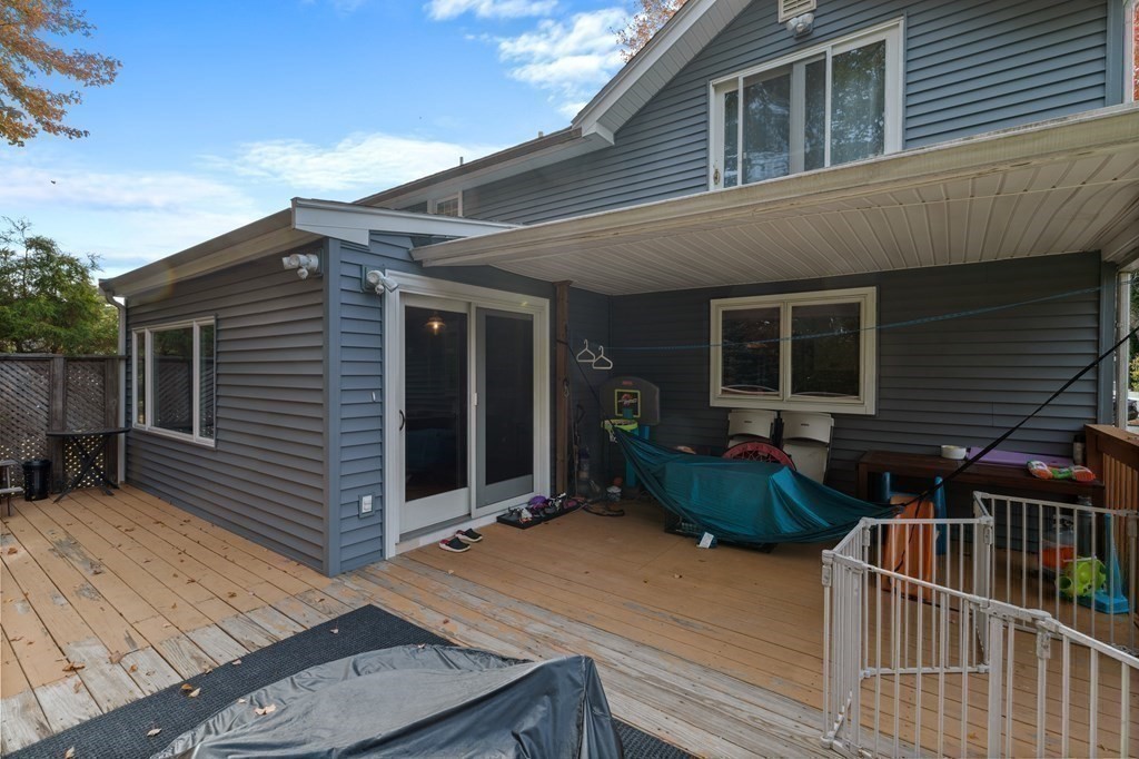 19 Manor Avenue Natick, MA 01760 - Photo 12 of 29 a backyard of a house with deck and furniture