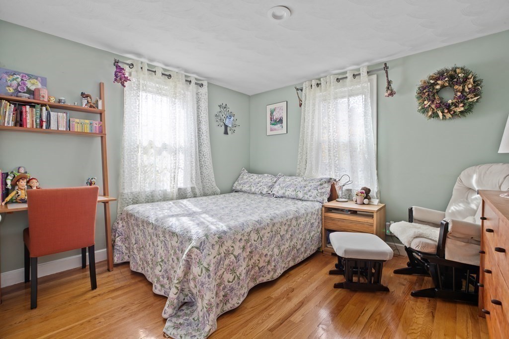 19 Manor Avenue Natick, MA 01760 - Photo 13 of 29 a bed room with a bed and a chair