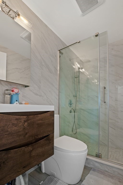 19 Manor Avenue Natick, MA 01760 - Photo 14 of 29 a bathroom with a toilet and a shower