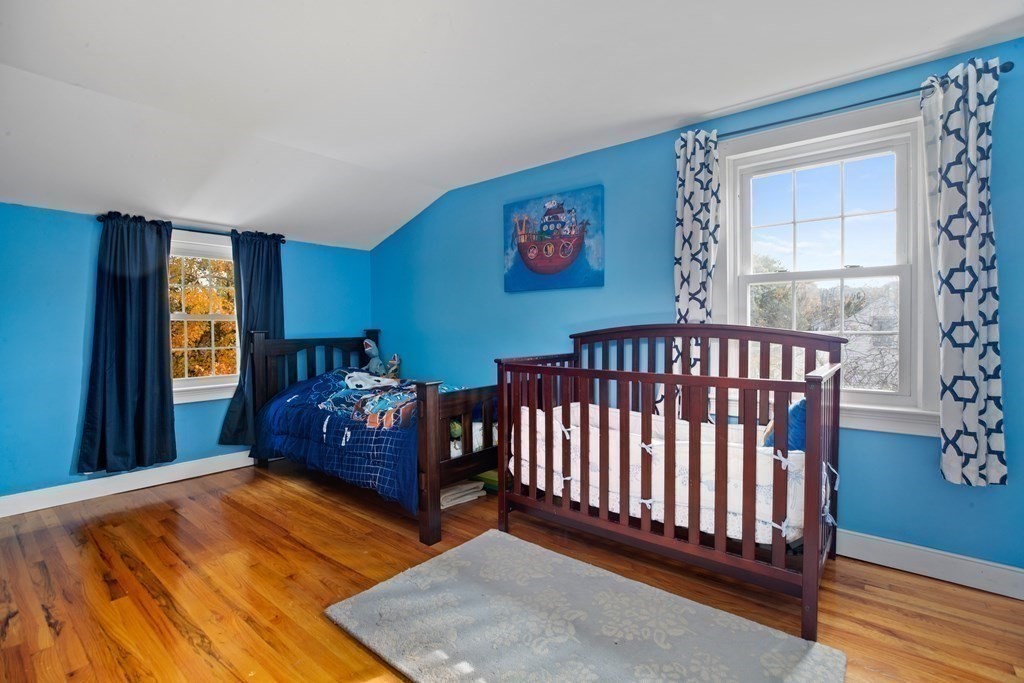 19 Manor Avenue Natick, MA 01760 - Photo 17 of 29 a bedroom with furniture and a window