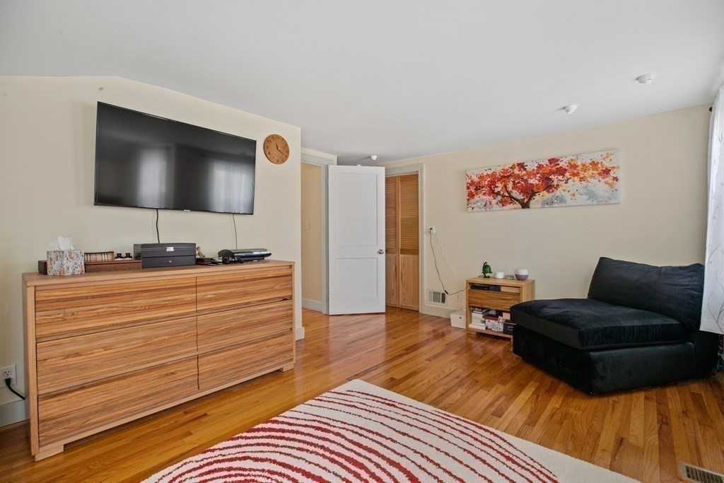 19 Manor Avenue Natick, MA 01760 - Photo 19 of 29 a living room with furniture and a flat screen tv