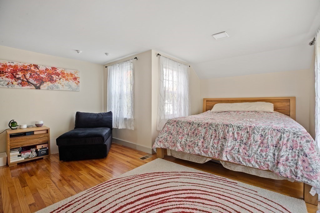 19 Manor Avenue Natick, MA 01760 - Photo 20 of 29 a bedroom with a bed and a couch