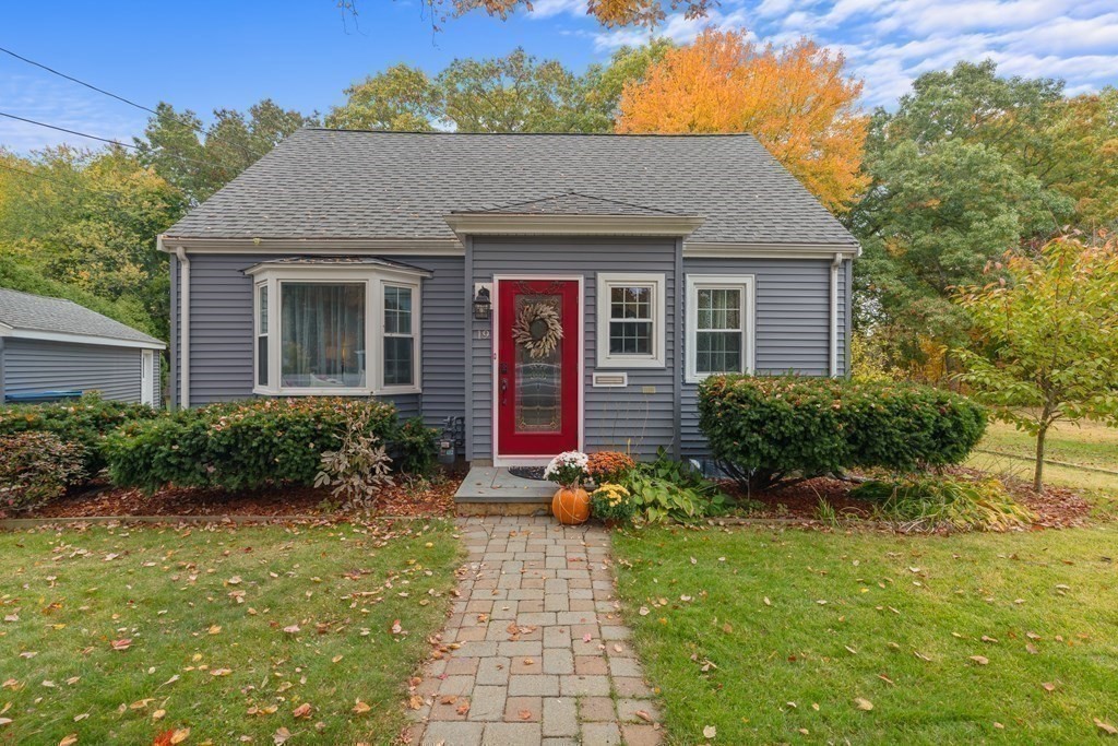 19 Manor Avenue Natick, MA 01760 - Photo 28 of 29 a view of a brick house with potted plants and a table and chairs