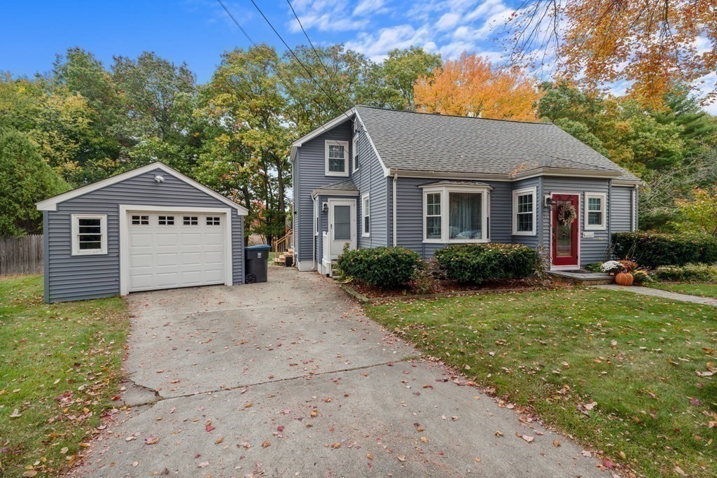 19 Manor Avenue Natick, MA 01760 - Photo 29 of 29 a front view of a house with a yard and garage