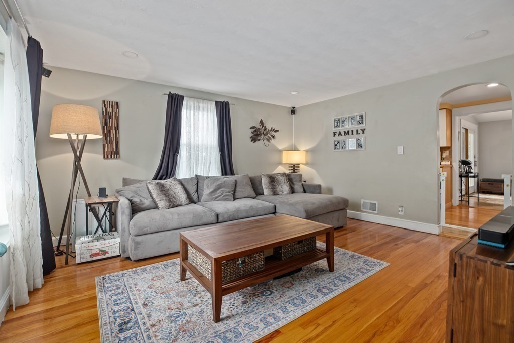 19 Manor Avenue Natick, MA 01760 - Photo 3 of 29 a living room with furniture and a wooden floor