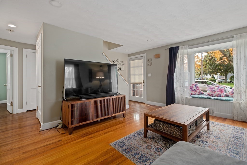 19 Manor Avenue Natick, MA 01760 - Photo 4 of 29 a living room with furniture and a flat screen tv