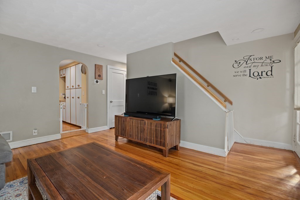 19 Manor Avenue Natick, MA 01760 - Photo 5 of 29 a living room with furniture and a flat screen tv