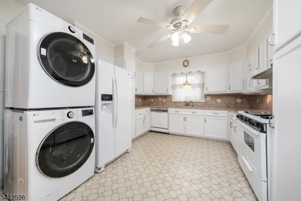 a kitchen with a stove top oven and a sink