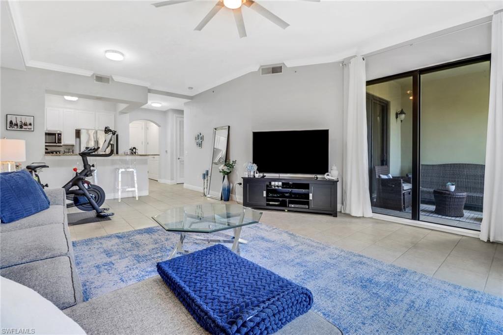 8011 Via Monte Carlo Way, Unit 2208 Estero, FL 33928 - Photo 12 of 34 a living room with furniture and a flat screen tv