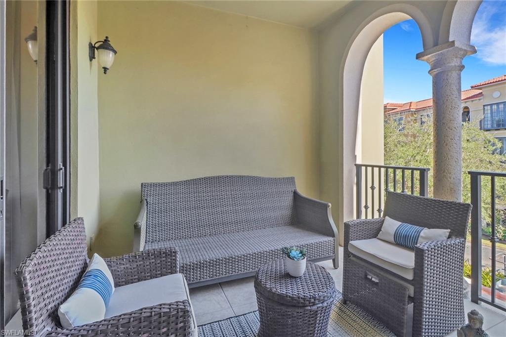 8011 Via Monte Carlo Way, Unit 2208 Estero, FL 33928 - Photo 14 of 34 a living room with furniture and a window