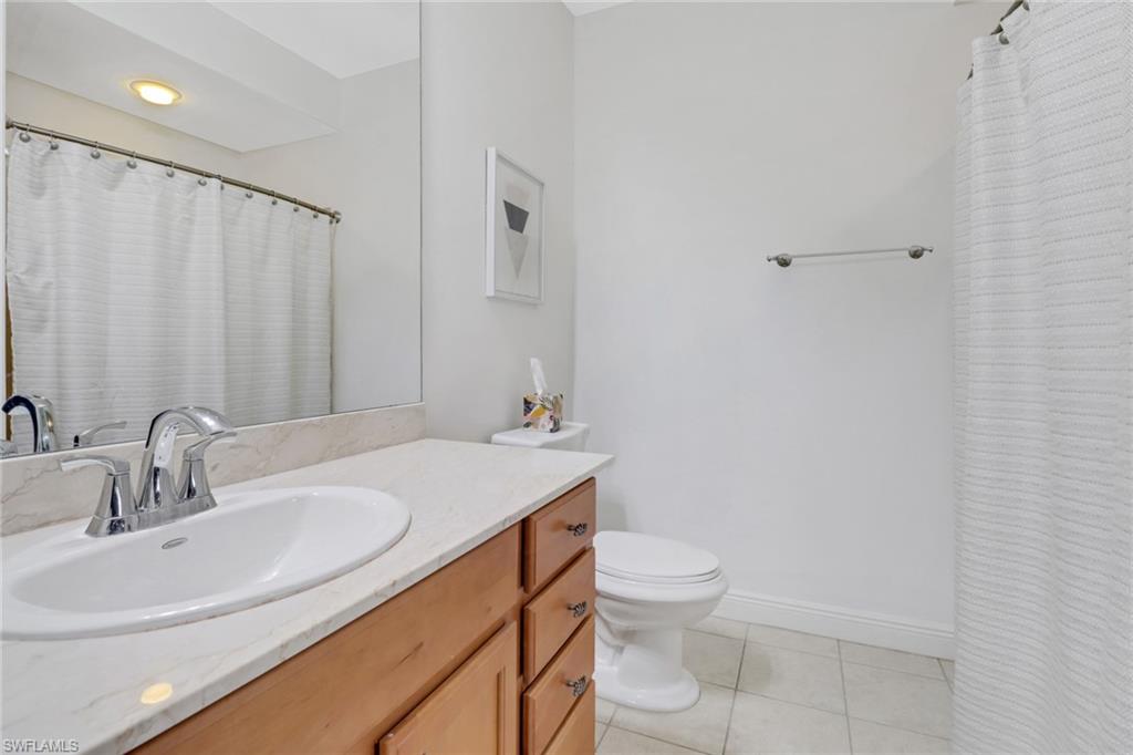 8011 Via Monte Carlo Way, Unit 2208 Estero, FL 33928 - Photo 19 of 34 a bathroom with a sink toilet and shower