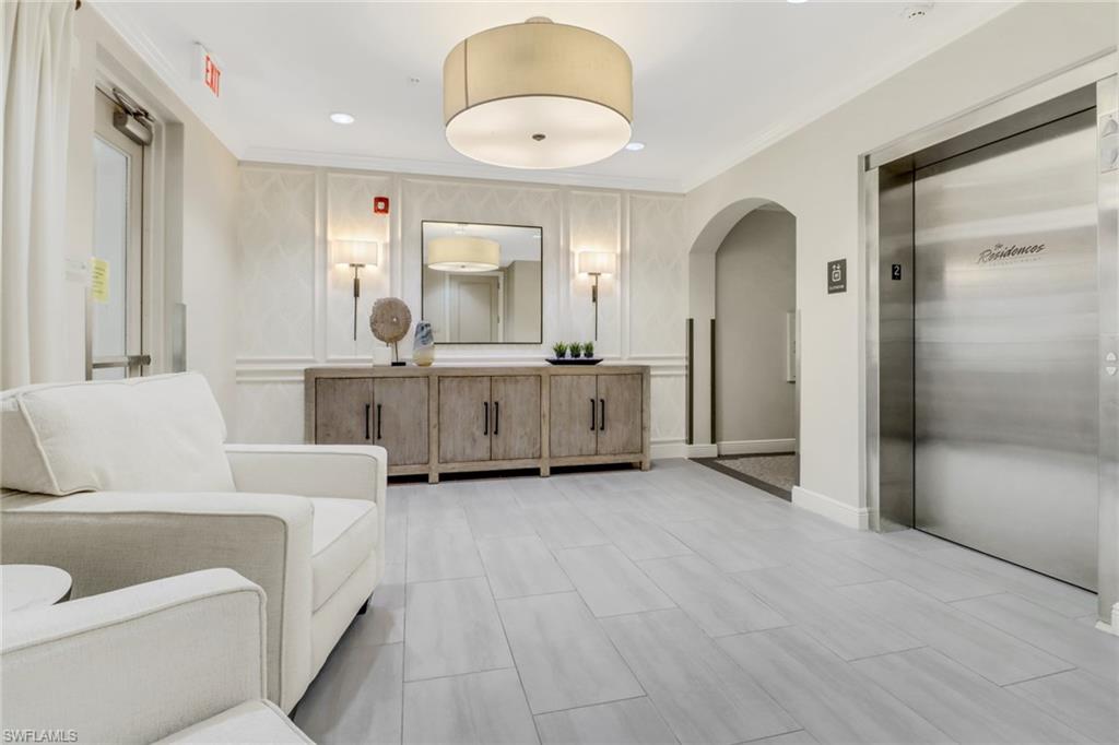 8011 Via Monte Carlo Way, Unit 2208 Estero, FL 33928 - Photo 22 of 34 a living room with furniture and window