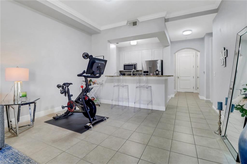 8011 Via Monte Carlo Way, Unit 2208 Estero, FL 33928 - Photo 9 of 34 a view of a room with gym equipment