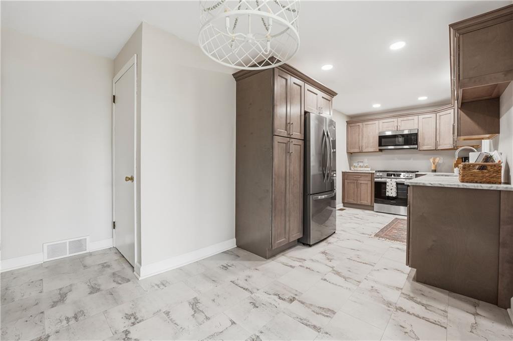 17 Shenango Road New Castle, PA 16105 - Photo 8 of 16 a kitchen with stainless steel appliances granite countertop a refrigerator and a sink