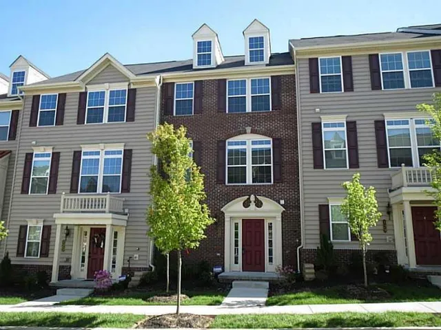 a front view of a house with yard
