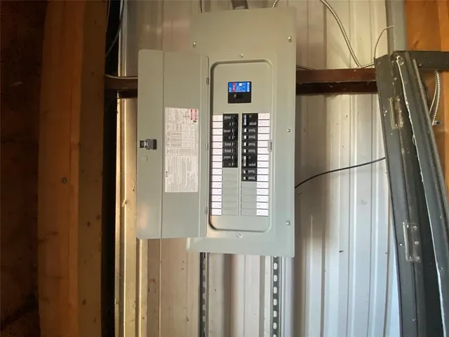 an empty room with entrance and windows