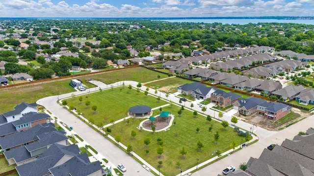 an aerial view of a residential houses with outdoor space