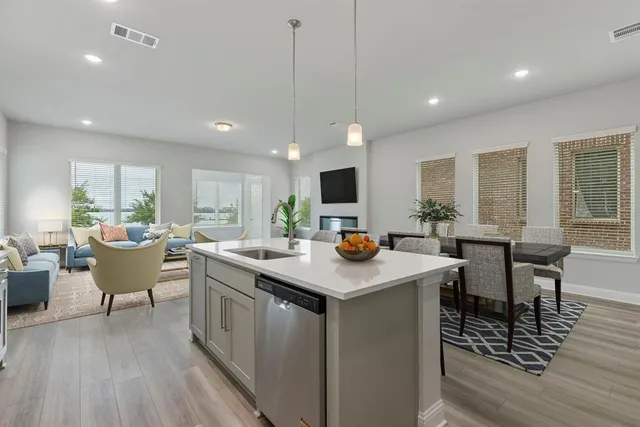 a kitchen with counter space dining table and chairs