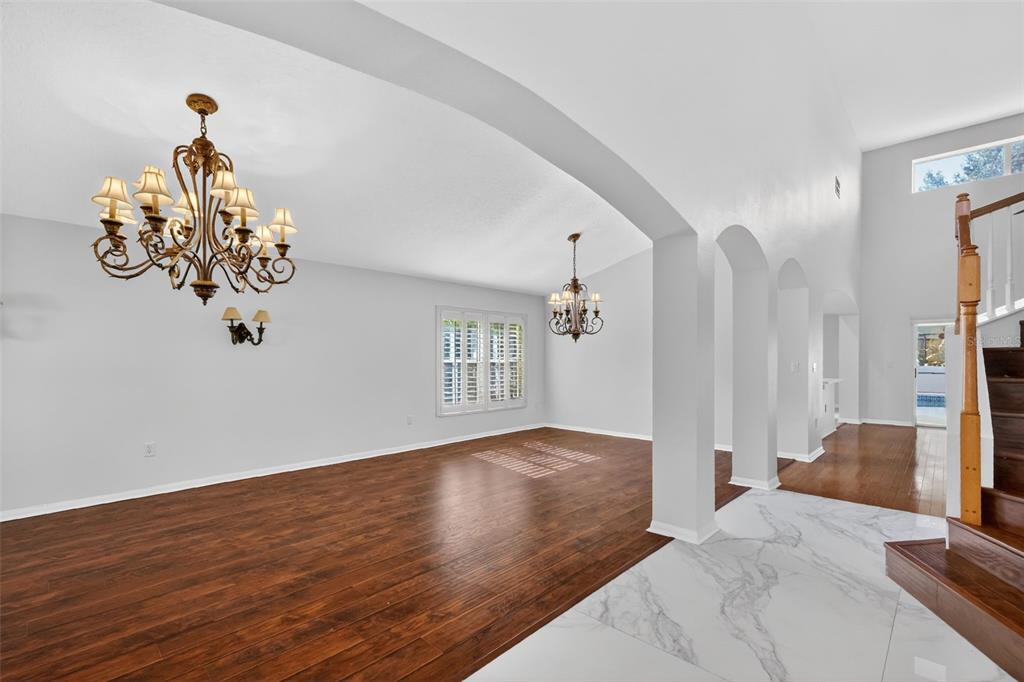 729 Strihal Loop Oakland, FL 34787 - Photo 11 of 49 a bedroom with a bed and chandelier