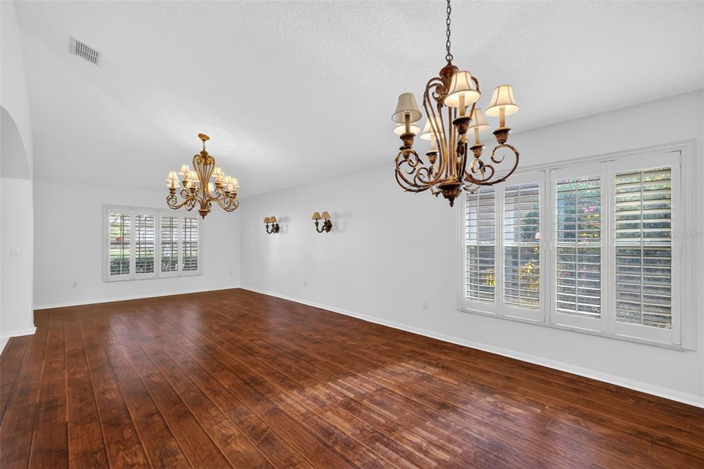 729 Strihal Loop Oakland, FL 34787 - Photo 12 of 49 a view of a room with wooden floor and windows