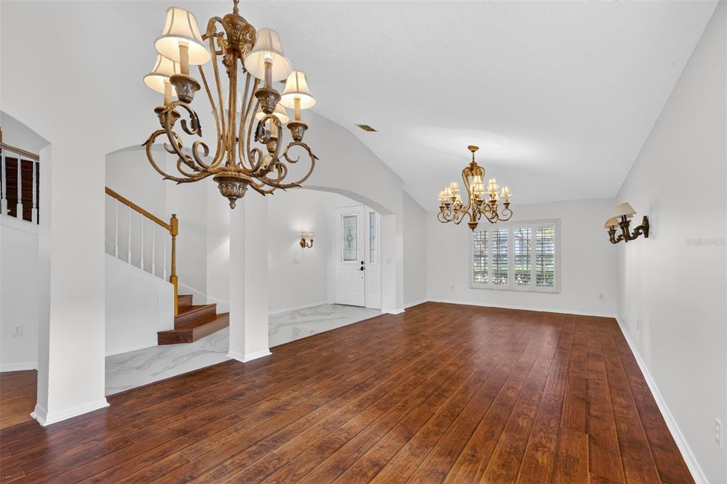 729 Strihal Loop Oakland, FL 34787 - Photo 13 of 49 a view of a livingroom with wooden floor