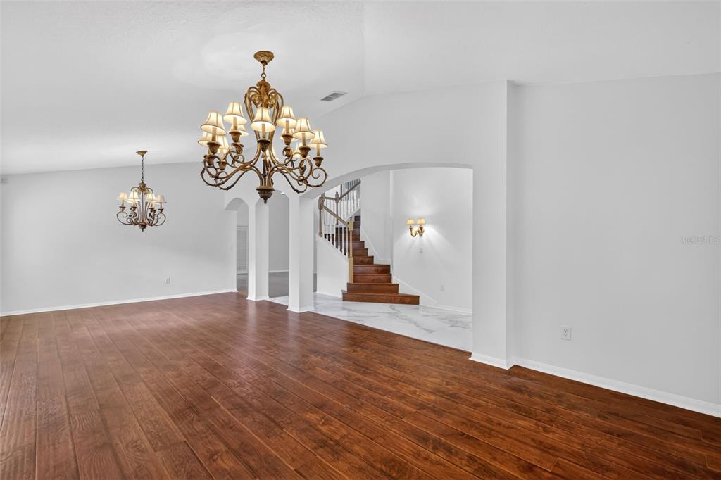 729 Strihal Loop Oakland, FL 34787 - Photo 14 of 49 a very nice looking room with wooden floor