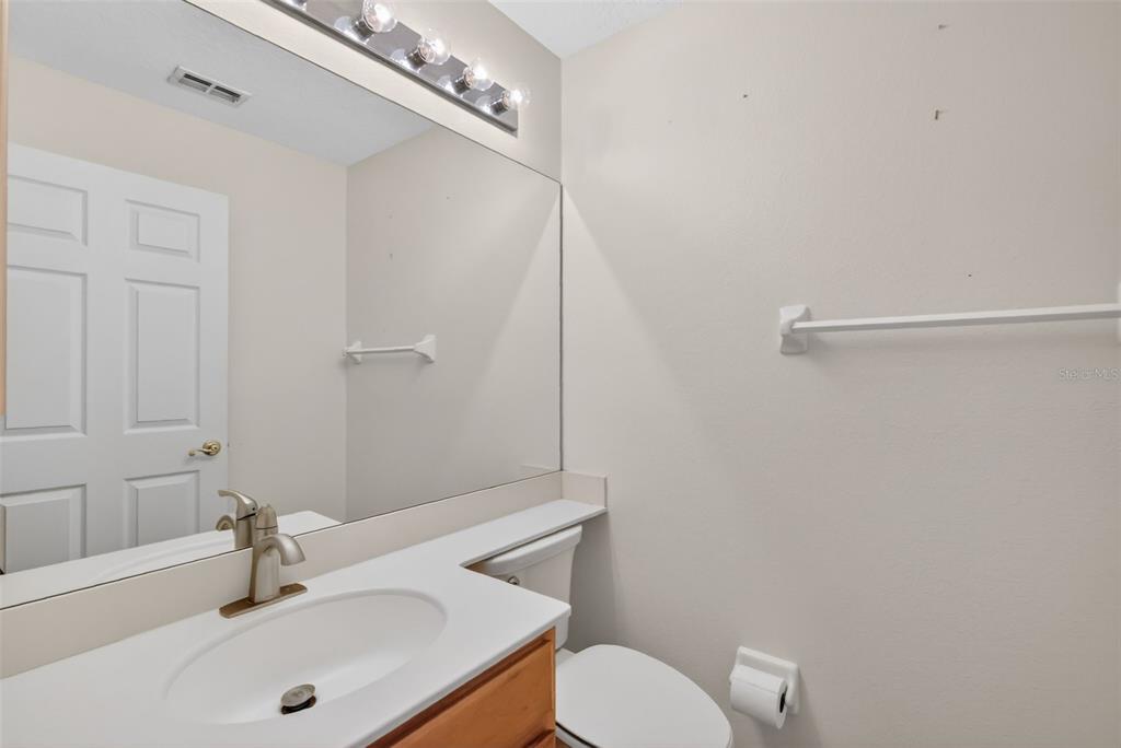 729 Strihal Loop Oakland, FL 34787 - Photo 32 of 49 a bathroom with a sink a toilet and shower