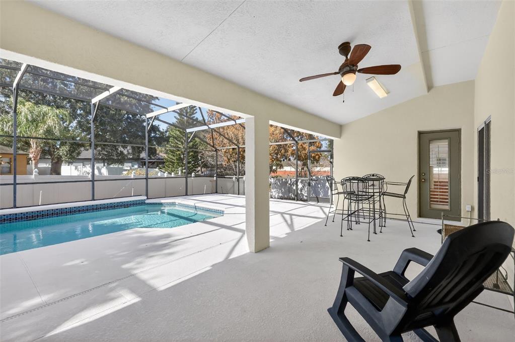 729 Strihal Loop Oakland, FL 34787 - Photo 42 of 49 a view of a living room and a floor to ceiling window and wooden fence