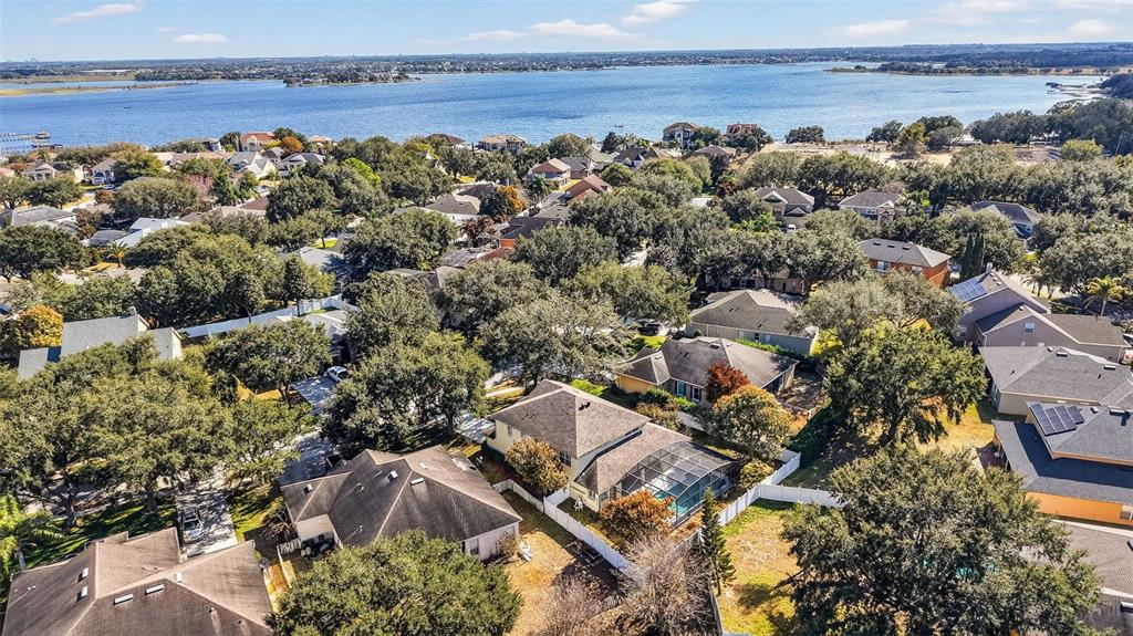 729 Strihal Loop Oakland, FL 34787 - Photo 5 of 49 an aerial view of a house with a lake view