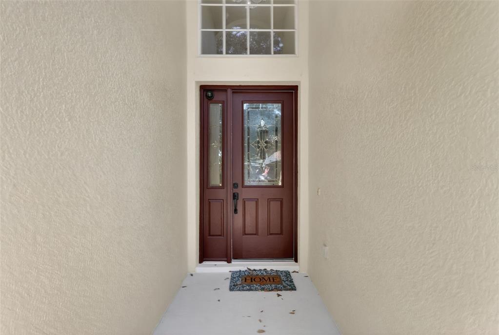 729 Strihal Loop Oakland, FL 34787 - Photo 10 of 49 a view of front door of a house