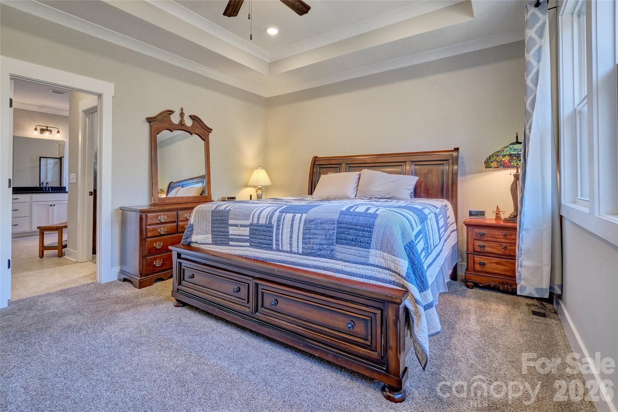 398 Kingsburry Road Clover, SC 29710 - Photo 17 of 48 a bedroom with a bed and a chandelier