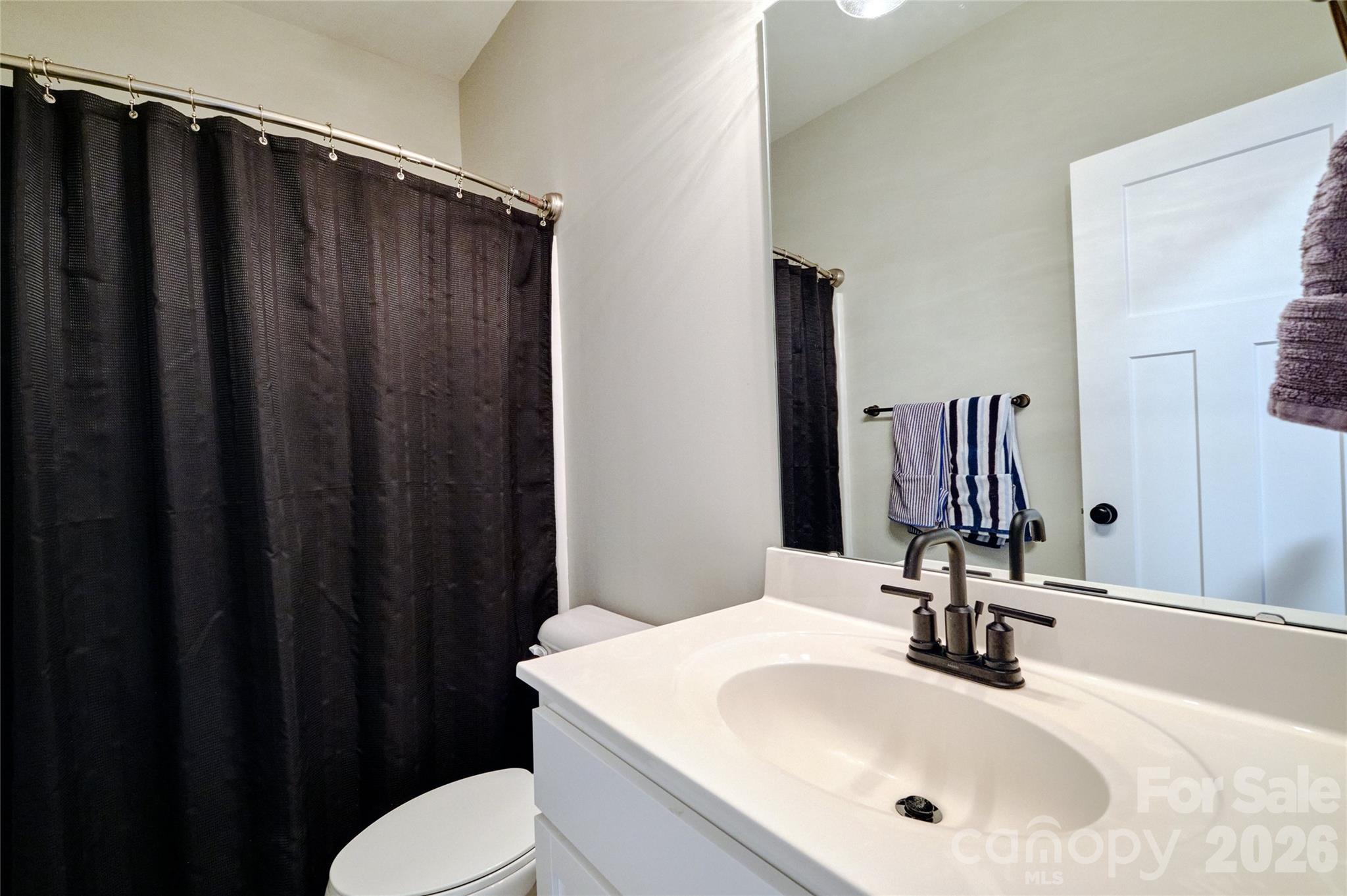 398 Kingsburry Road Clover, SC 29710 - Photo 32 of 48 a bathroom with a sink and a mirror