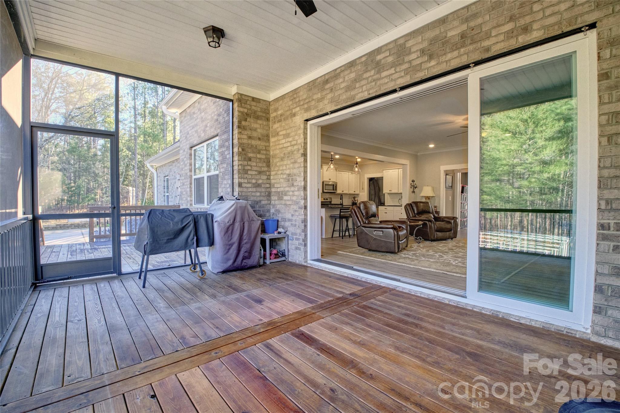 398 Kingsburry Road Clover, SC 29710 - Photo 36 of 48 a living room with furniture floor to ceiling window and wooden floor