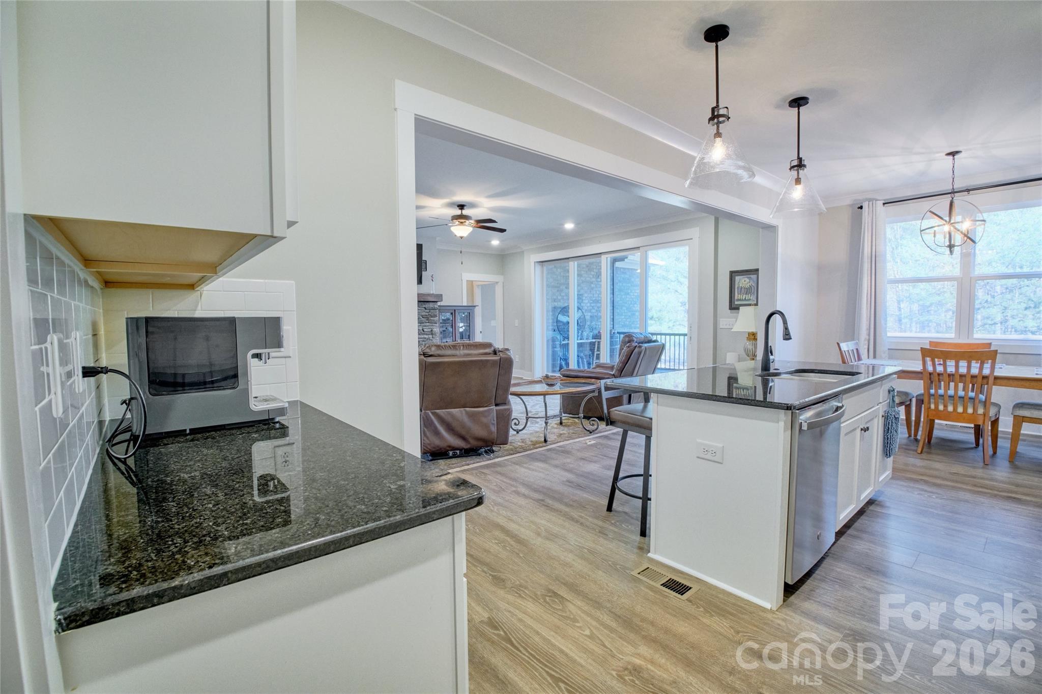 398 Kingsburry Road Clover, SC 29710 - Photo 9 of 48 a kitchen with kitchen island a counter top space a sink stainless steel appliances and cabinets