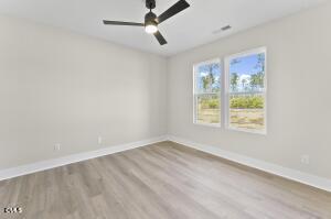 2760 River Meadow Spring Hope, NC 27882 - Photo 21 of 42 a view of an empty room with a window