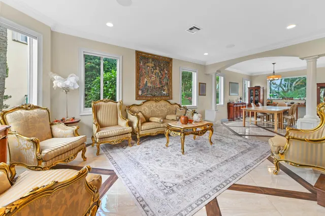 a view of a livingroom with furniture window and wooden floor