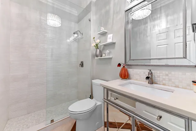 a kitchen with stainless steel appliances kitchen island granite countertop a sink and cabinets