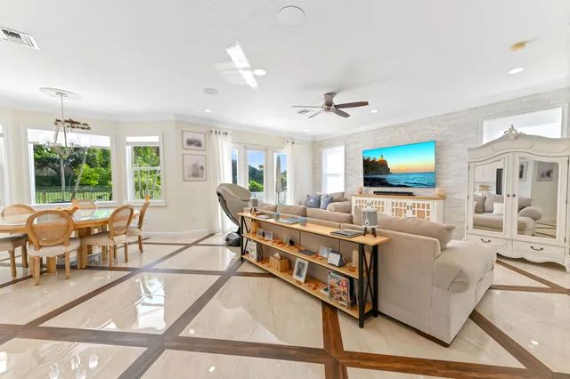 a kitchen with stainless steel appliances kitchen island granite countertop a sink and cabinets