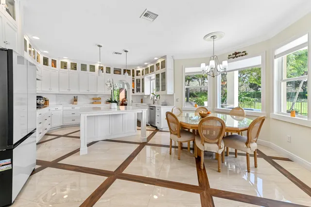 a bathroom with a granite countertop sink mirror and vanity